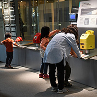 Visitors trying out the public telephones