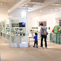 Mother and child viewing exhibits at the telephone corner