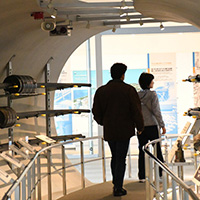 Visitors walking through the Cable Tunnel.