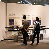 Visitors viewing a submarine repeater exhibit