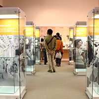 Visitors viewing exhibits at the mobile telephone corner